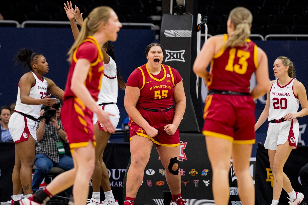Audi Crooks pumps her fists to the ground after scoring two against Oklahoma during the Big 12 Tournament on March 11, 2024 in the T-Mobile Center.