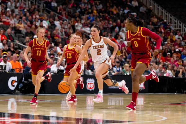 Iowa State players Emily Ryan (11), Hannah Belanger (13) and Isnelle Natabou (0) cover Shaylee Gonzales of Texas down the court during the Big 12 Tournament final on March 12, 2024, in the T-Mobile Center.