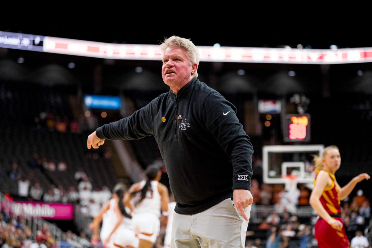 Coach Bill Fennelly debates a travel call charged to Iowa State during the Big 12 Tournament final against Texas on March 12, 2024, in the T-Mobile Center.