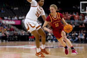 Emily Ryan of Iowa State pushes past Madison Booker of Texas during the Big 12 Tournament final on March 12, 2024, T-Mobile Center.