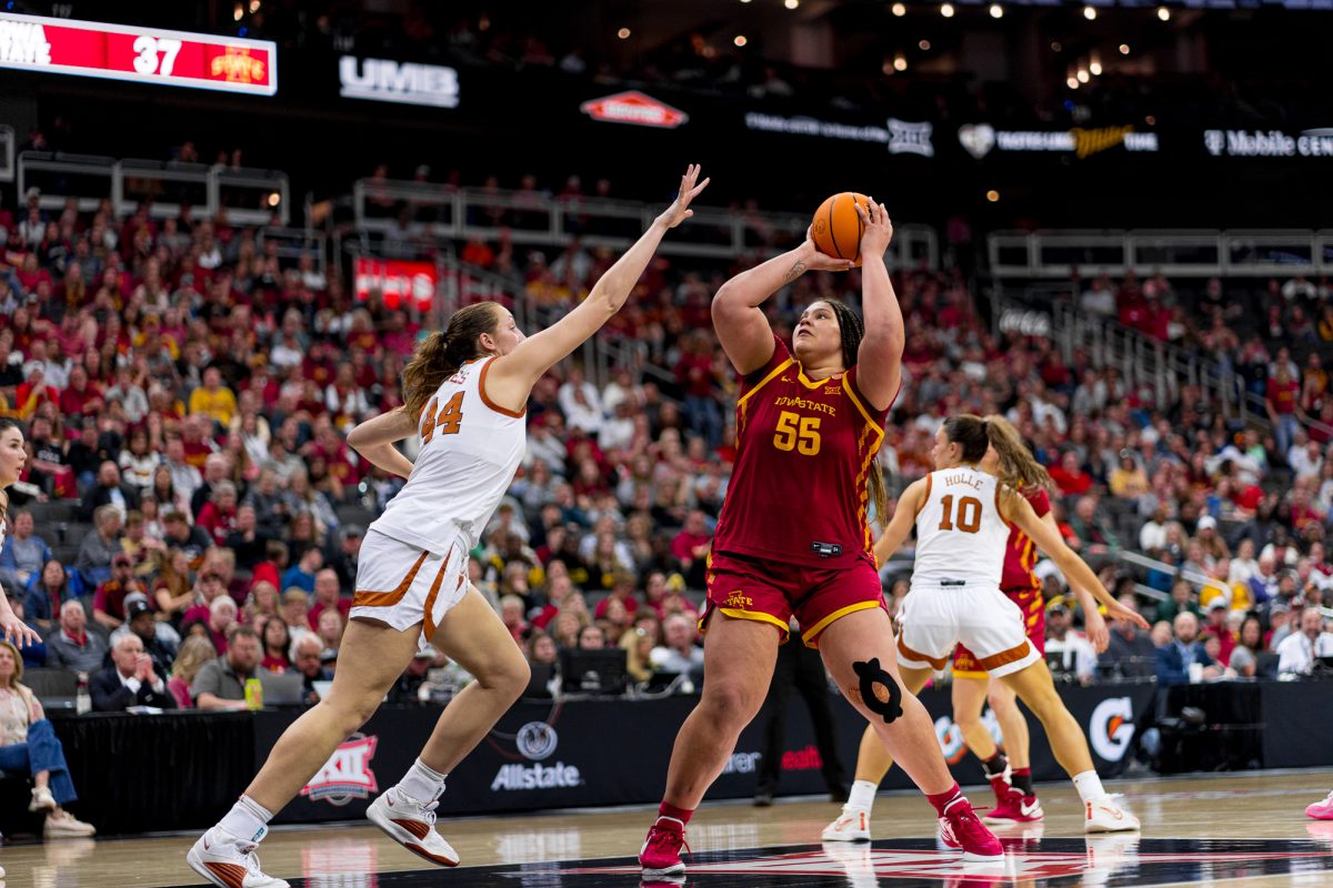 Audi Crooks takes a step back to shoot a two against Taylor Jones of Texas for the Womens Big 12 Tournament final on March 12, 2024, at the T-Mobile Center.