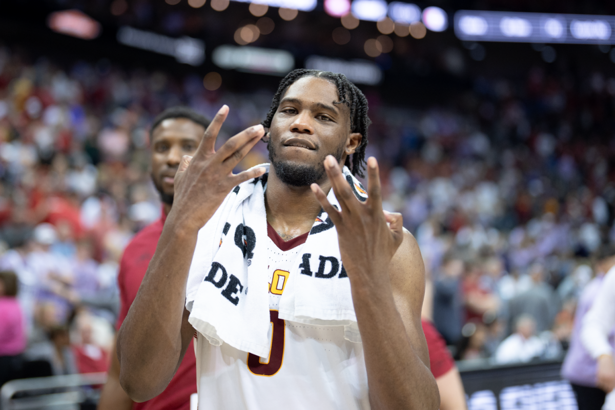 Tre King throws up Ws after Iowa State defeats Kansas State 76-57 at the Big 12 mens basketball tournament game against Kansas State, T-Mobile Center, Kansas City on March 14, 2024.