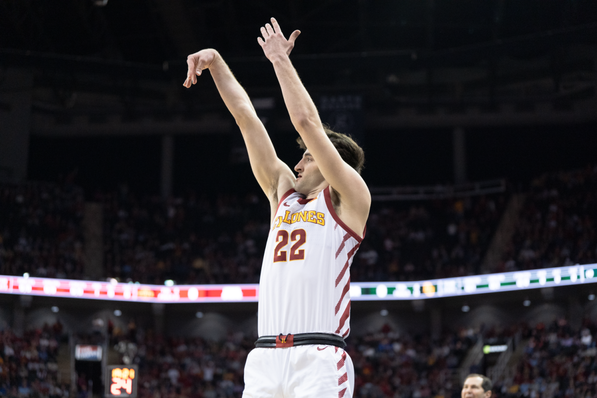 Milan Momcilovic makes a corner three to open the scoring at the mens basketball Big 12 tournament semifinal game against Baylor, T-Mobile Center, Kansas City, March 15, 2024.