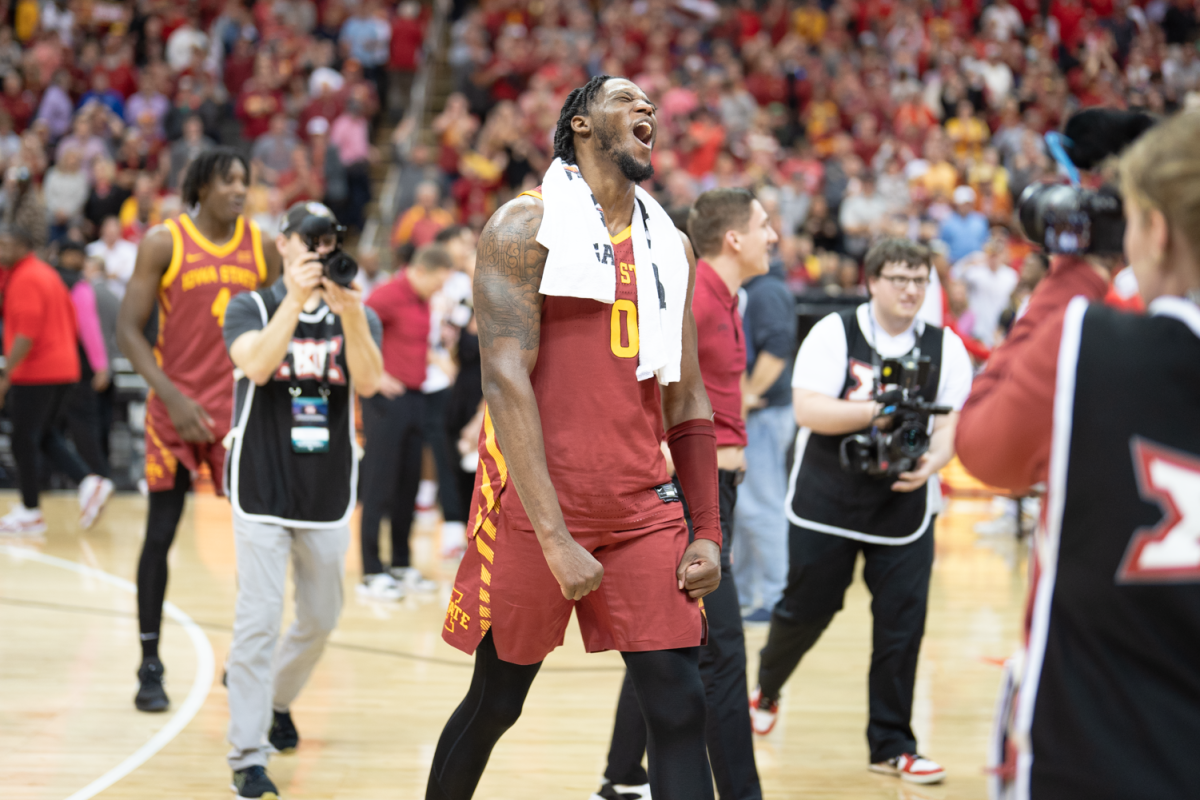 Tre King celebrates on the court after Iowa State defeats Houston in the Big 12 Championship 69-41 at the mens basketball Big 12 Championship game against Houston, T-Mobile Center, Kansas City, March 16, 2024.