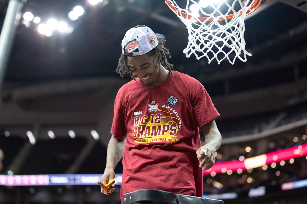 Keshon Gilbert cuts down the nets after Iowa State defeated Houston in the Big 12 Championship 69-41 at the mens basketball Big 12 Championship game against Houston, T-Mobile Center, Kansas City, March 16, 2024.