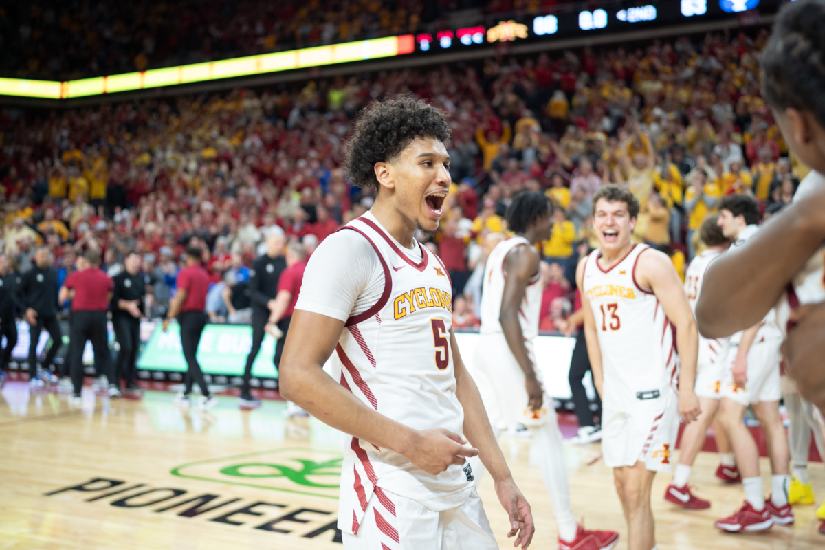 Curtis Jones celebrates on the court after Iowa State completes the 14 point comeback against BYU on Mar. 6, 2023.