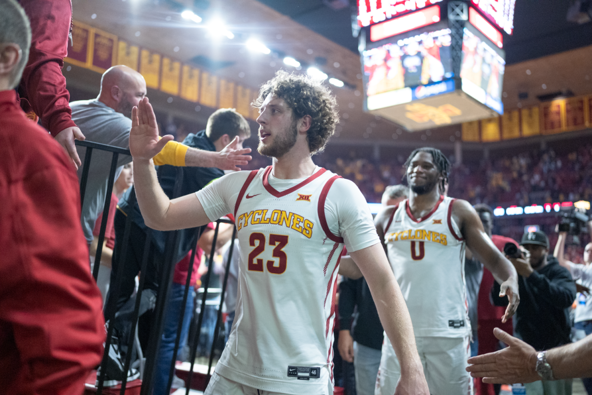 Conrad+Hawley+high-fives+Iowa+State+fans+after+Iowa+State+completes+the+14+point+comeback+against+BYU+on+Mar.+6%2C+2023.