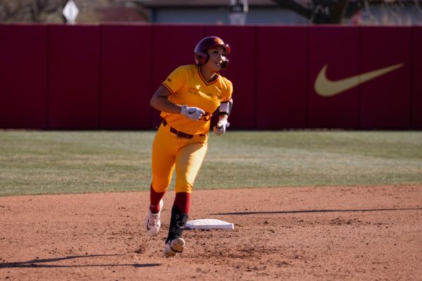Tiana Poole smiles as she rounds second base after hitting a home run during the Iowa State vs. DePaul softball game at Cyclones Sports Complex, April 9, 2024.