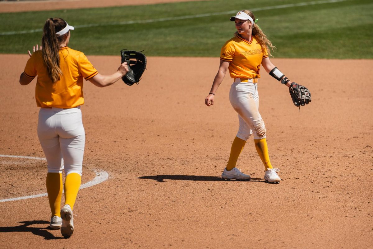 McKenna+Andrews+talks+with+Karli+Spelhaug+after+a+play+in+the+Iowa+State+vs.+Oklahoma+State+home+stand+at+Cyclone+Sports+Complex%2C+April+14%2C+2024.