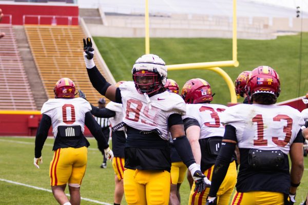 Trent Jones II holds up three fingers to signal third down during the Spring Game at Jack Trice Stadium on April 20, 2024.