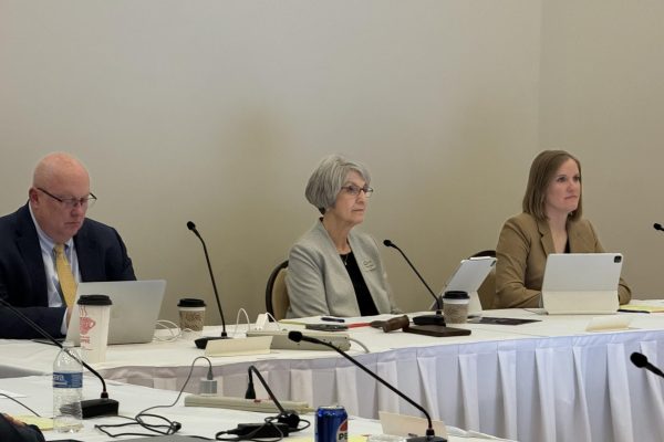Mark Braun, executive director of the Iowa Board of Regents and Regents Sherry Bates and Greta Rouse participate in a meeting at the Alumni Center on April 24, 2024. 