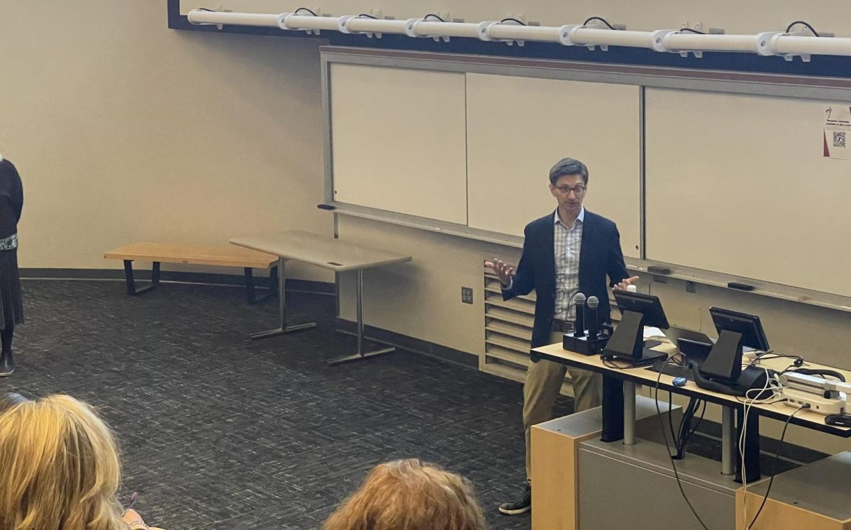 Gregg Colburn, a professor of public policy, governance and real estate at the University of Washington, addresses attendees of his lecture Homelessness is a housing problem in the Design Building on April 18, 2024. 