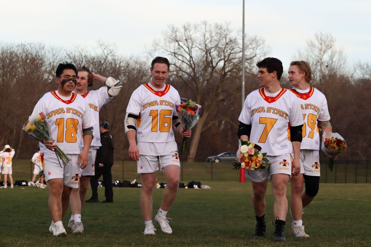 Iowa State mens lacrosse seniors walk toward their family members before being announced at the Iowa State vs. Illinois lacrosse game, April 5, 2024, at the Lied Recreation Center. 
