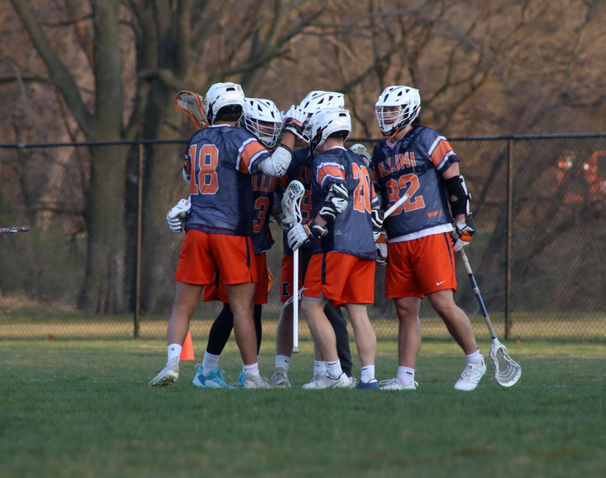 Illinois players celebrate after they scored at the Iowa State vs. Illinois lacrosse game, April 5, 2024 at the Lied  Recreation Center. 