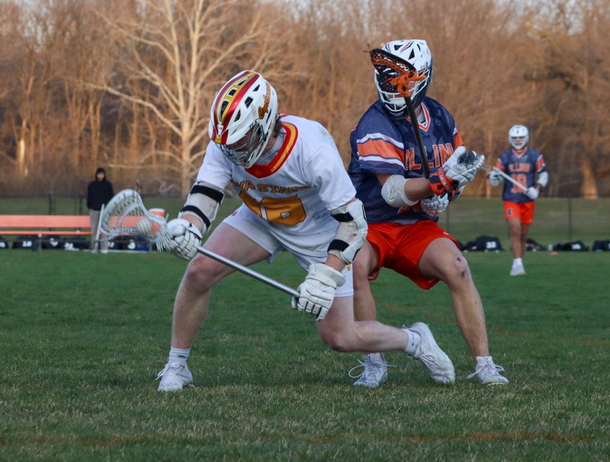 Mason Wattleworth fights to keep possession of the ball at the Iowa State vs. Illinois lacrosse game, April 5, 2024, at the Lied Recreation Center. 