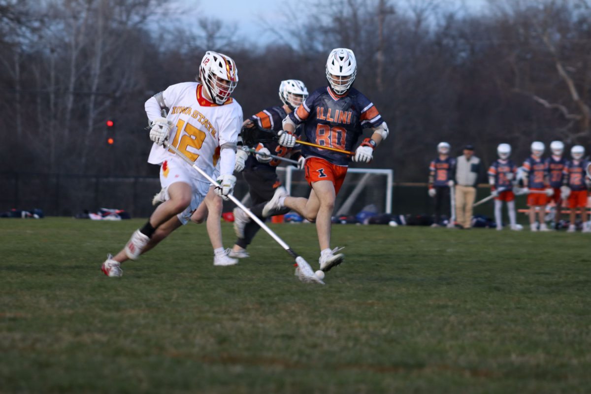 John Van Bergen, sophomore, runs to pick up the ball before the opponent does at the Iowa State vs. Illinois lacrosse game, April 5, 2024, at the Lied Recreation Center. 