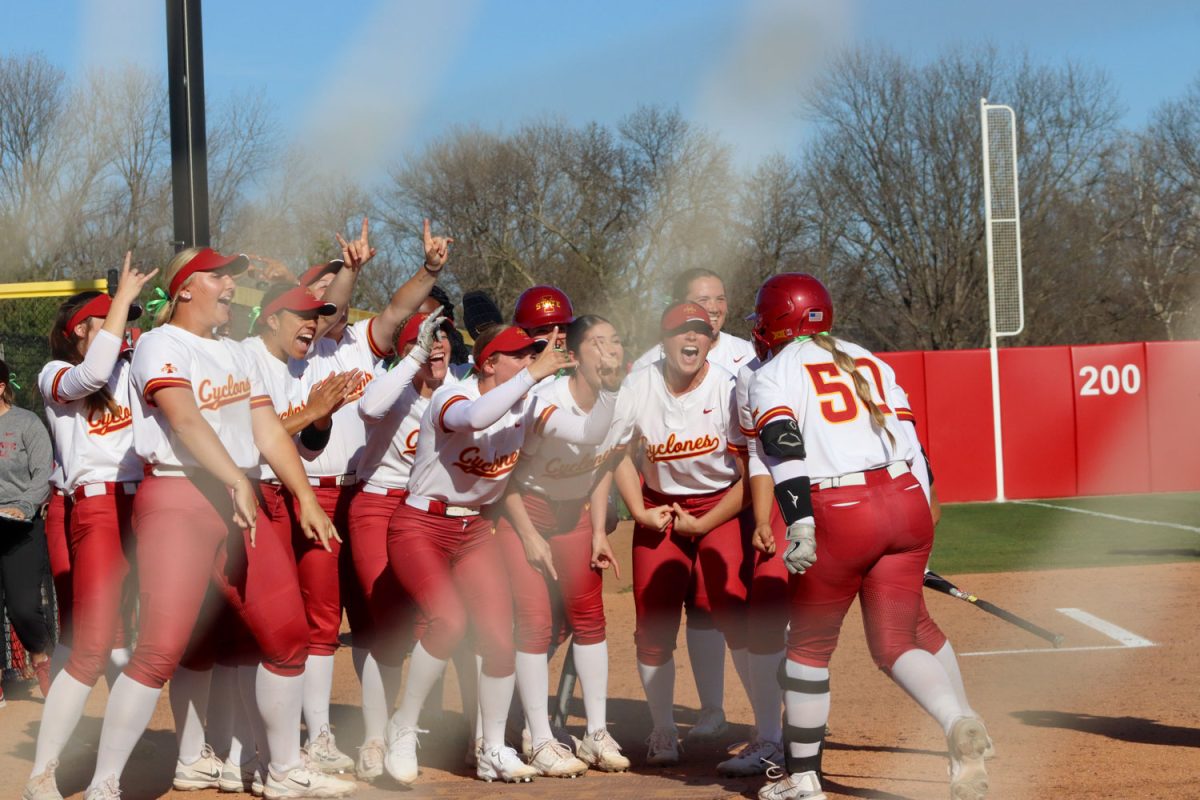 Iowa State softball team cheers on number 50, Ashley Minor after a home run at the Iowa State vs. Oklahoma State game at the Cyclones Sports Complex, April 12, 2024.