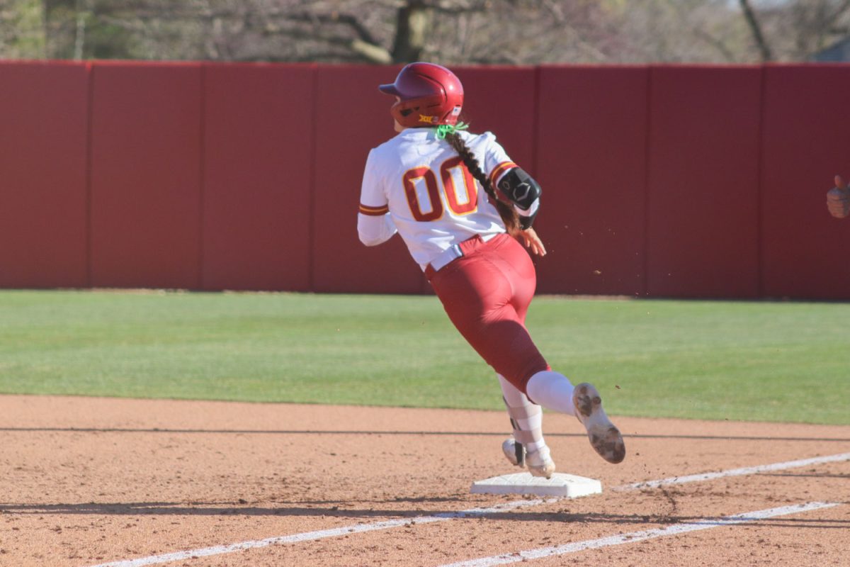 Milaysia Ochoa rounds to first base at the Iowa State vs. Oklahoma State game at the Cyclones Sports Complex, April 12, 2024.
