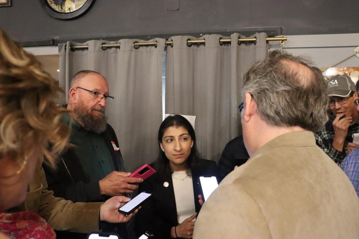 Lina Khan, who is the Federal Trade Commission chair, listens to a question being asked by a media member at the FTC chair event in Nevada, Iowa, on April 20, 2024.