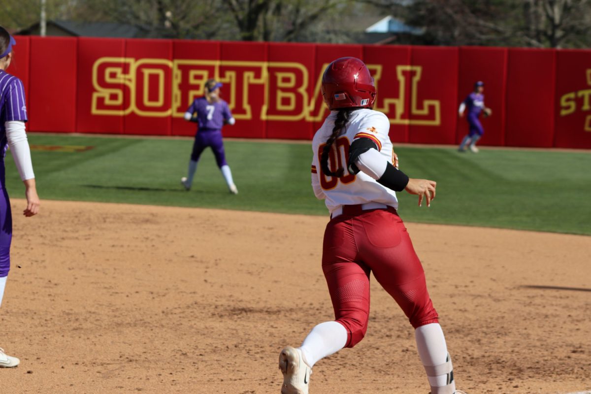 Milaysia Ochoa rounds to first base at the Iowa State vs. St. Thomas game at the Cyclones Sports Complex, April 23, 2024.