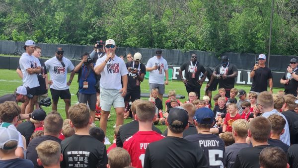 Former Iowa State quarterback Brock Purdy speaks to campers at his youth football camp on a practice field next to Jack Trice Stadium on June 22, 2024.