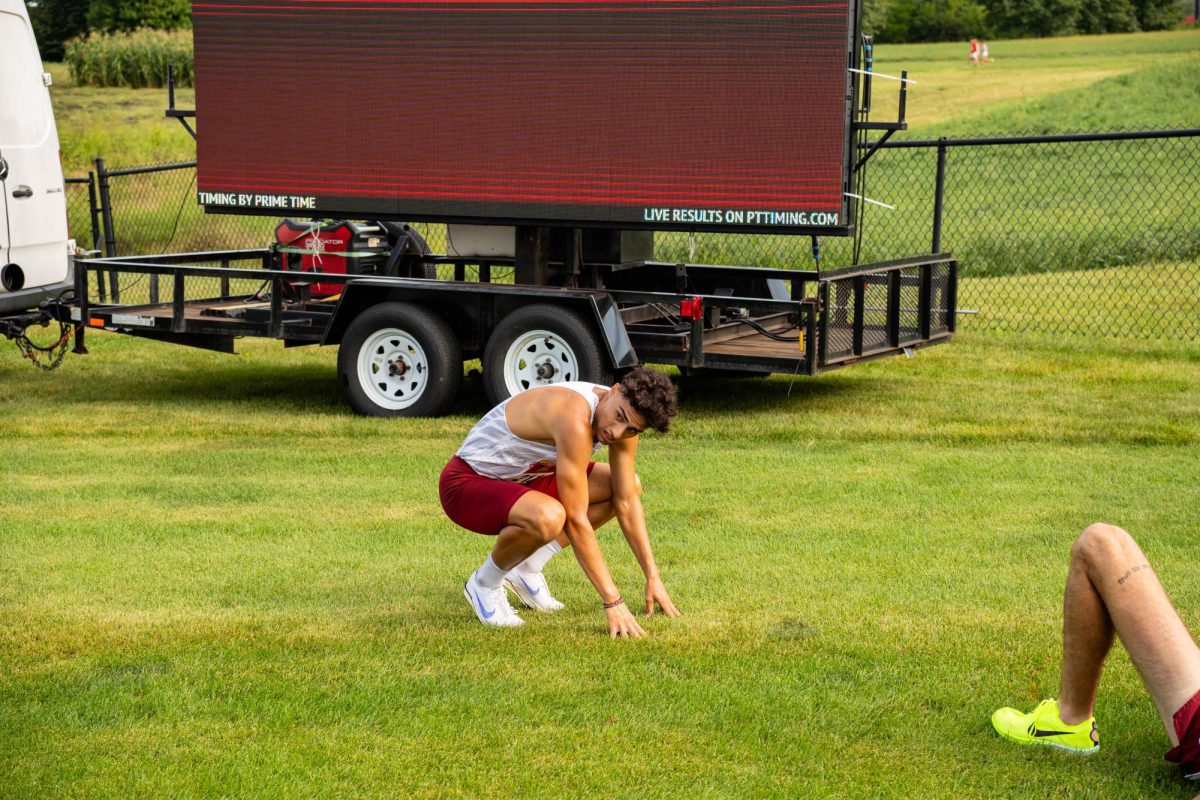 Devan Kipyego recovers after finishing first at the Cyclone Preview Cross Country meet, Iowa State University Cross Country Course, Aug. 30, 2024.