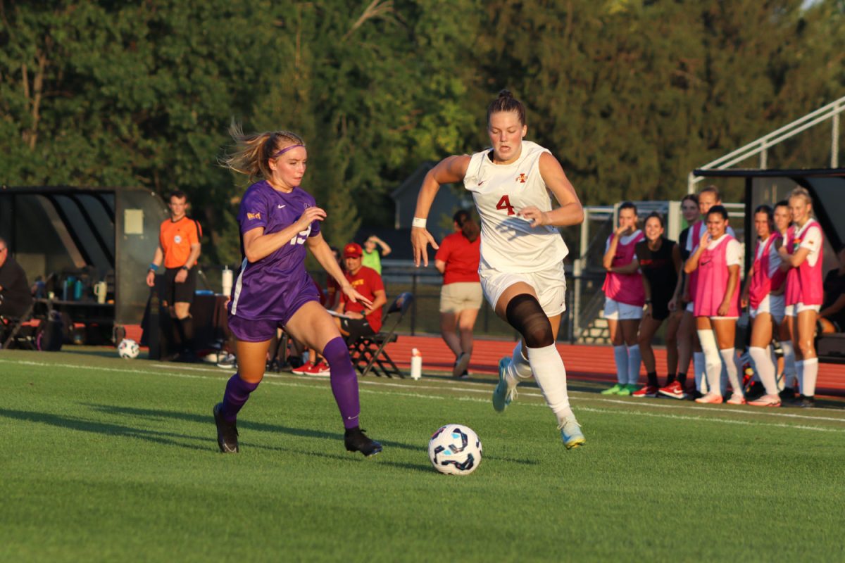 Ella Zimmerman takes the ball down the field as she outruns a University of Northern Iowa player at the Iowa State vs. University of Northern Iowa match, Cyclones Sports Complex, Aug. 25, 2024. 