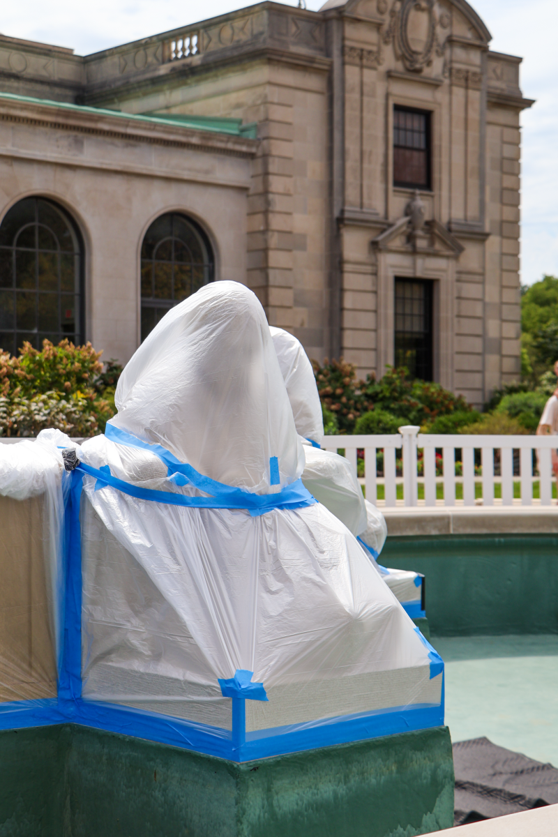 Fountain of the Four Seasons Sculptures covered in plastic wrap during construction, Aug. 27, 2024, in Ames, Iowa.