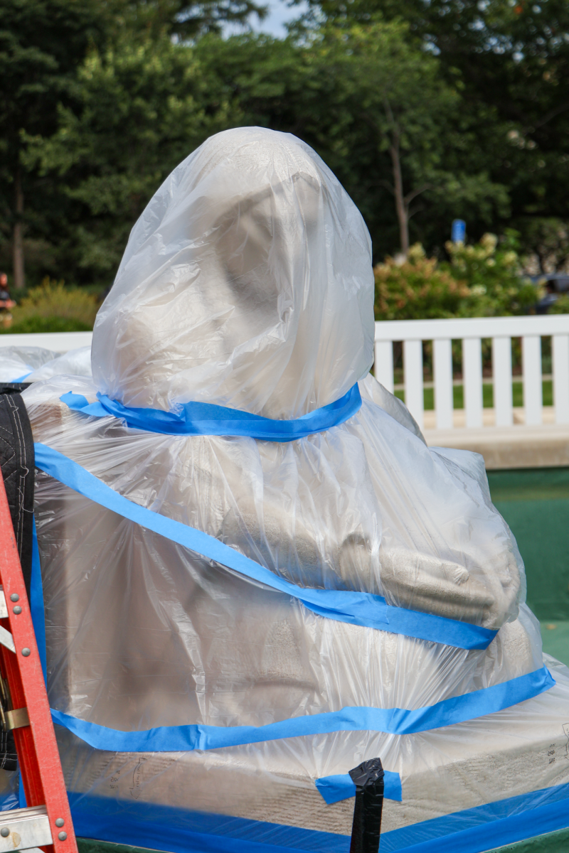 Fountain of the Four Seasons Sculptures covered in plastic wrap during construction, Aug. 27, 2024, in Ames, Iowa.