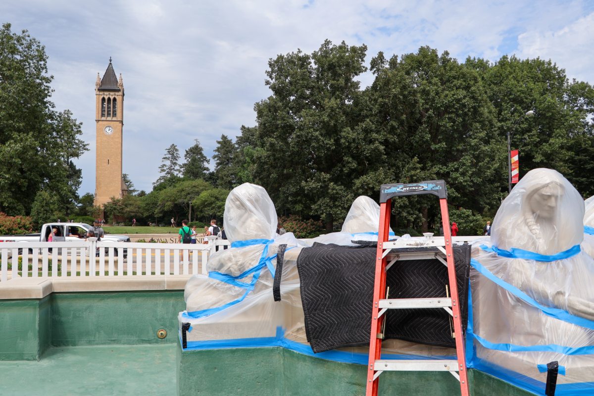 Fountain of the Four Seasons Sculptures covered in plastic wrap during construction, Aug. 27, 2024, in Ames, Iowa.