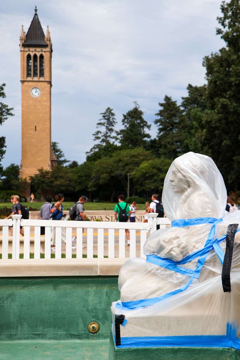 Fountain of the Four Seasons Sculptures covered in plastic wrap during construction, Aug. 27, 2024, in Ames, Iowa.