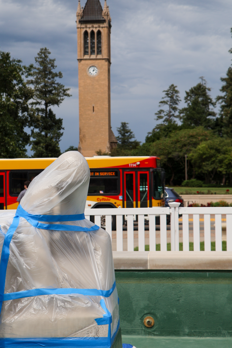 Fountain of the Four Seasons Sculptures covered in plastic wrap during construction, Aug. 27, 2024, in Ames, Iowa.