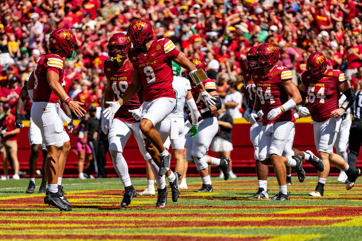 Jayden Higgins (9) jumps in the air dapping up Rocco Becht (3) after scoring a touchdown within the first drive for the Iowa State vs. North Dakota home game on Aug. 31, 2024.