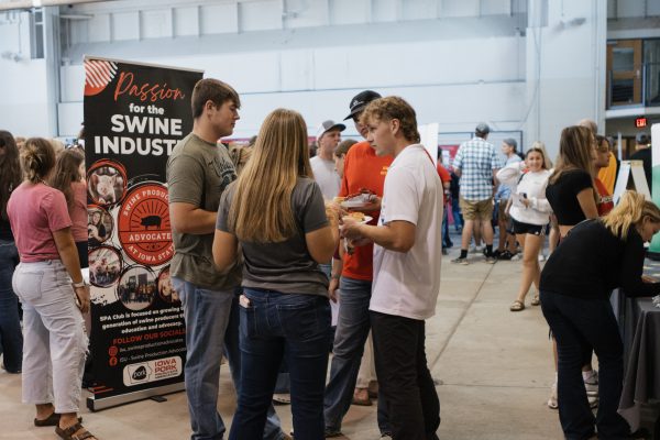 Students talk at the CALS BBQ at the Kildee Hall Iowa Farm Bureau Pavilion on Sept. 5, 2024.