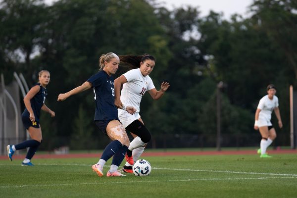 Sophia Thomas (10) contests Michigan’s Avery Peters (25) during the Iowa State vs. Michigan match, Cyclone Sports Complex, Sept. 5, 2024.