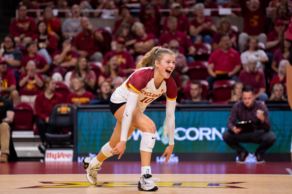 Rachel Van Gorp running to her team to celebrate during the Iowa State vs. Iowa match, Hilton Coliseum, Sept. 11, 2024.