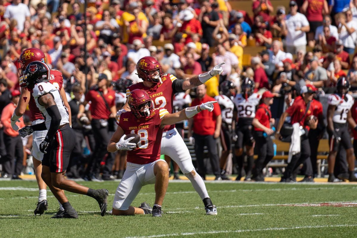 Benjamin Brahmer (18) celebrates with a teammate after getting a first down during the Iowa State vs. Arkansas State match, Jack Trice Stadium, Sept. 21, 2024.