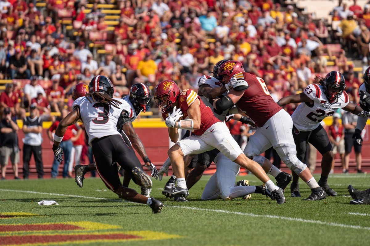 Carson Hansen (26) running the ball into the endzone during the Iowa State vs. Arkansas State match, Jack Trice Stadium, Sept. 21, 2024.