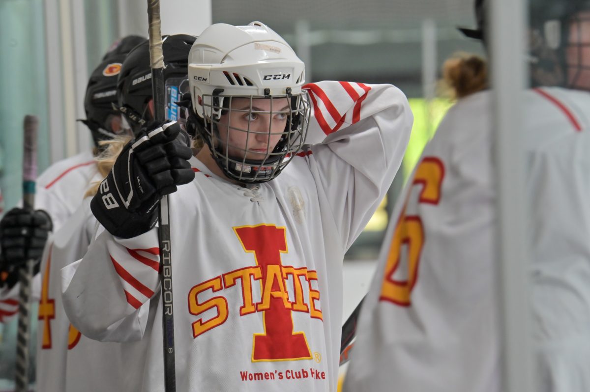 Iowa State women's hockey club player #12 gets ready for the game against university of Iowa women's club hockey team at ISU Ice Arena for a home opener, Sept. 27, 2024.