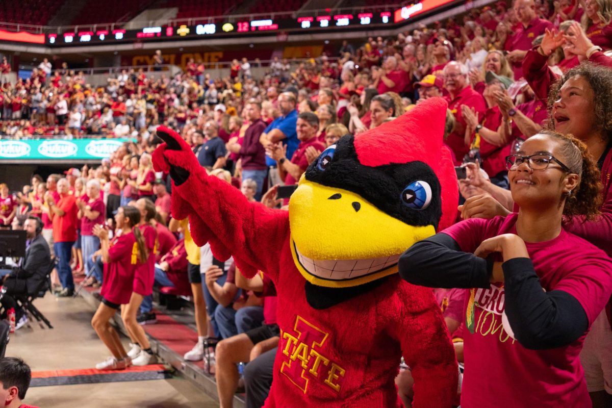 Cy dances with spectators during the Iowa Corn Cy-Hawk series volleyball meet against the University of Iowa, Hilton Coliseum, Sept. 11, 2024.