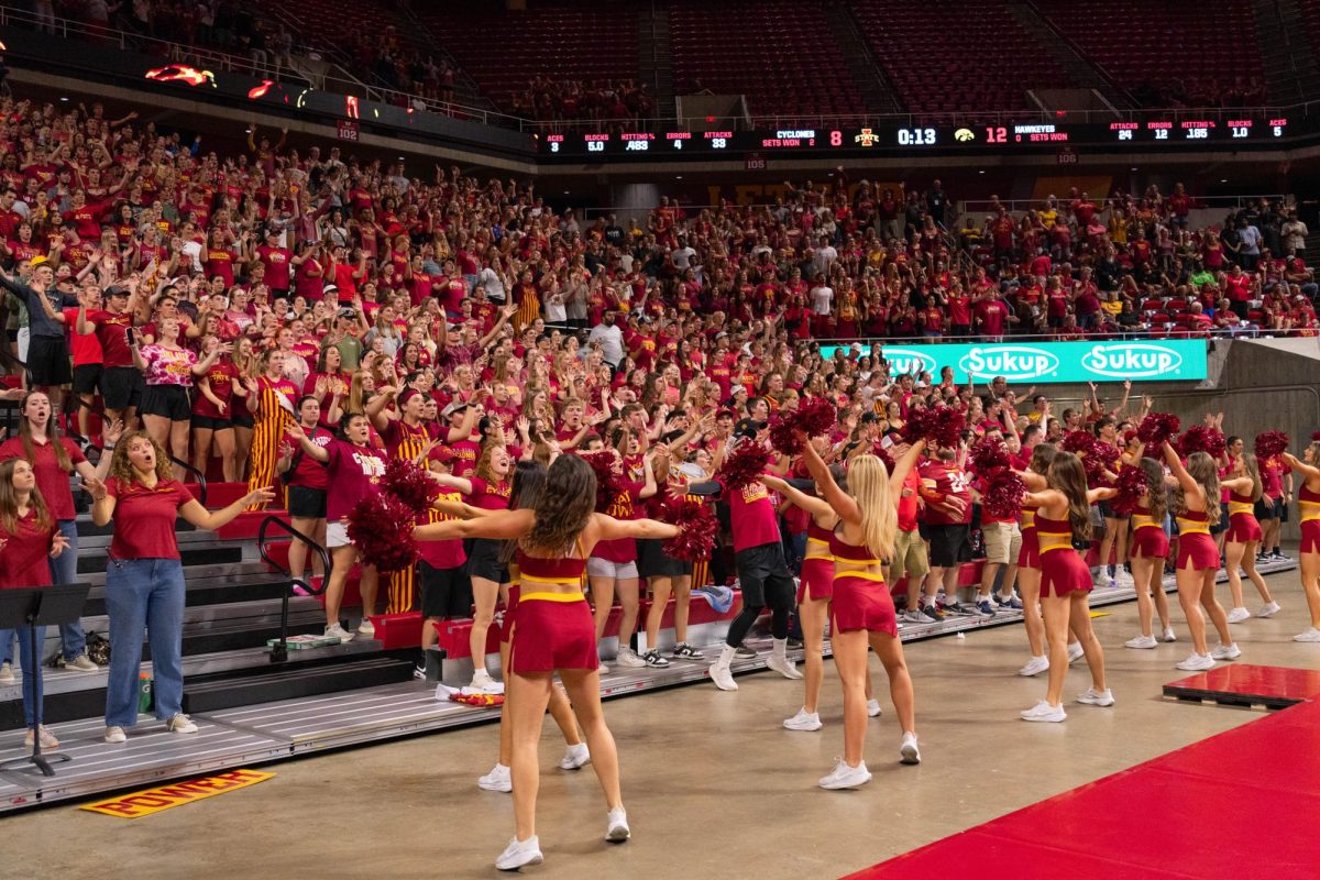 Iowa State student section dances at the Iowa Corn Cy-Hawk series volleyball meet against the University of Iowa, Hilton Coliseum, Sept. 11, 2024.