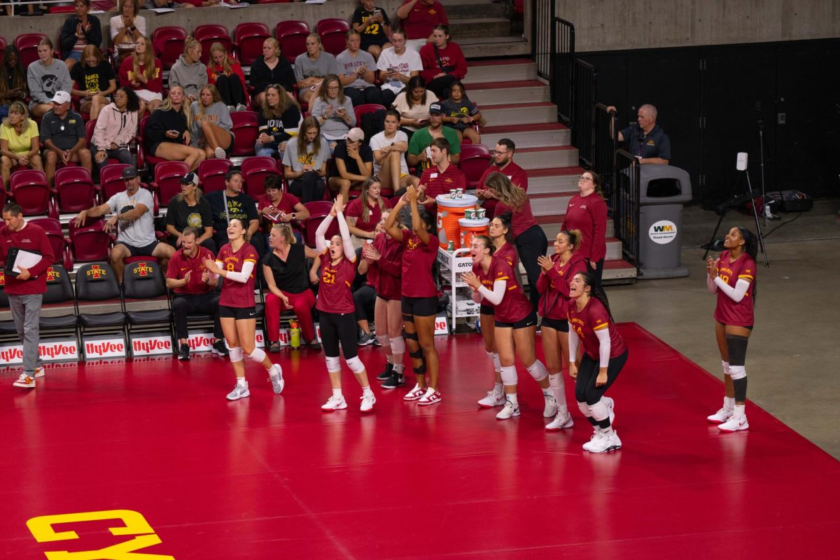 Iowa State bench celebrates after scoring a point in the final set during the Iowa Corn Cy-Hawk series volleyball meet against the University of Iowa, Hilton Coliseum, Sept. 11, 2024.