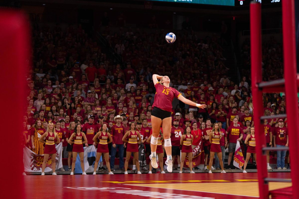 Lilly Wachholz serves the ball as part of the Iowa Corn Cy-Hawk series volleyball meet against the University of Iowa, Hilton Coliseum, Sept. 11, 2024.