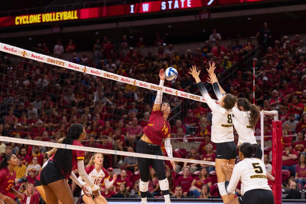 Nayeli Gonzalez spikes the ball as part of the Iowa Corn Cy-Hawk series volleyball meet against the University of Iowa, Hilton Coliseum, Sept. 11, 2024.