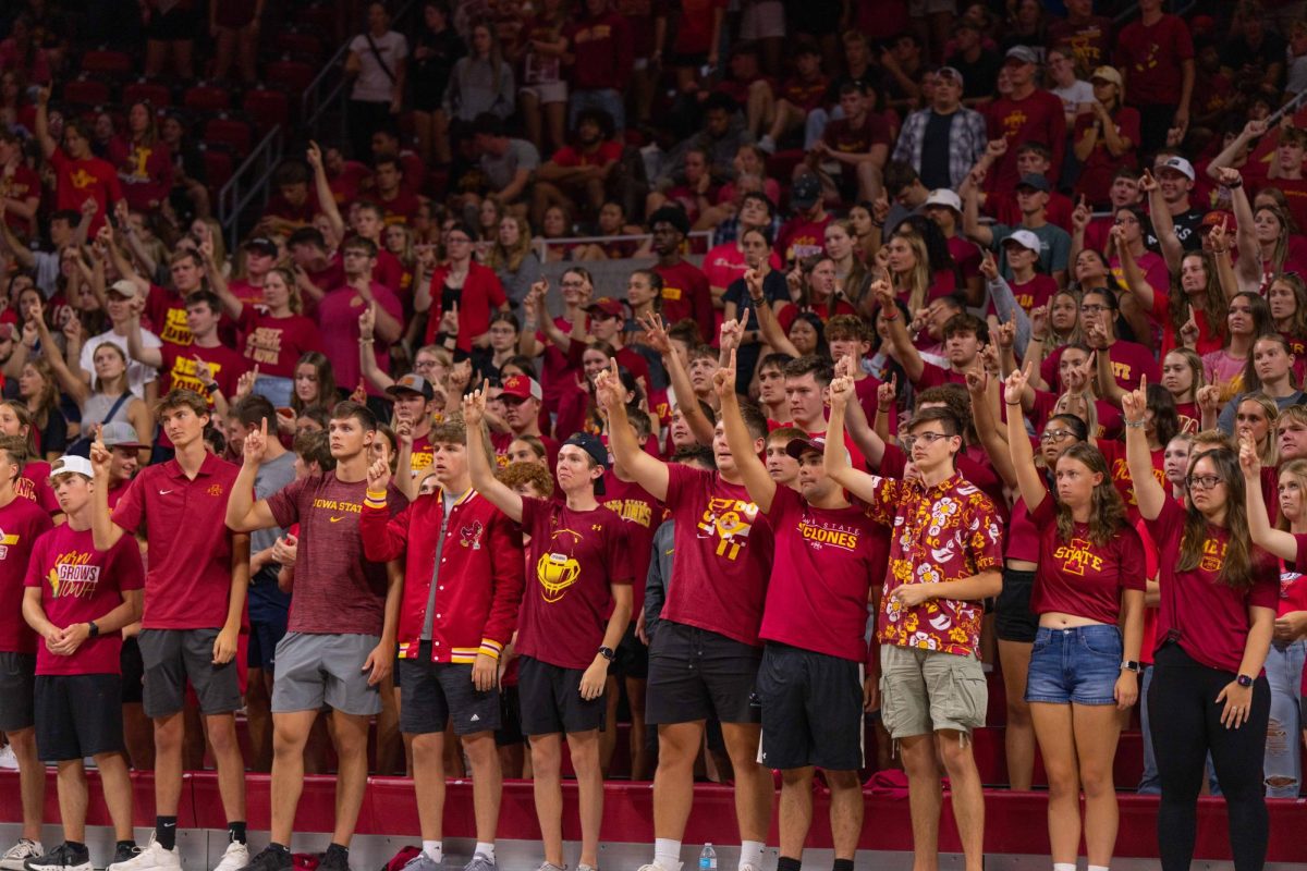 Iowa State students watch the set point at the Iowa Corn Cy-Hawk series volleyball meet against the University of Iowa, Hilton Coliseum, Sept. 11, 2024.