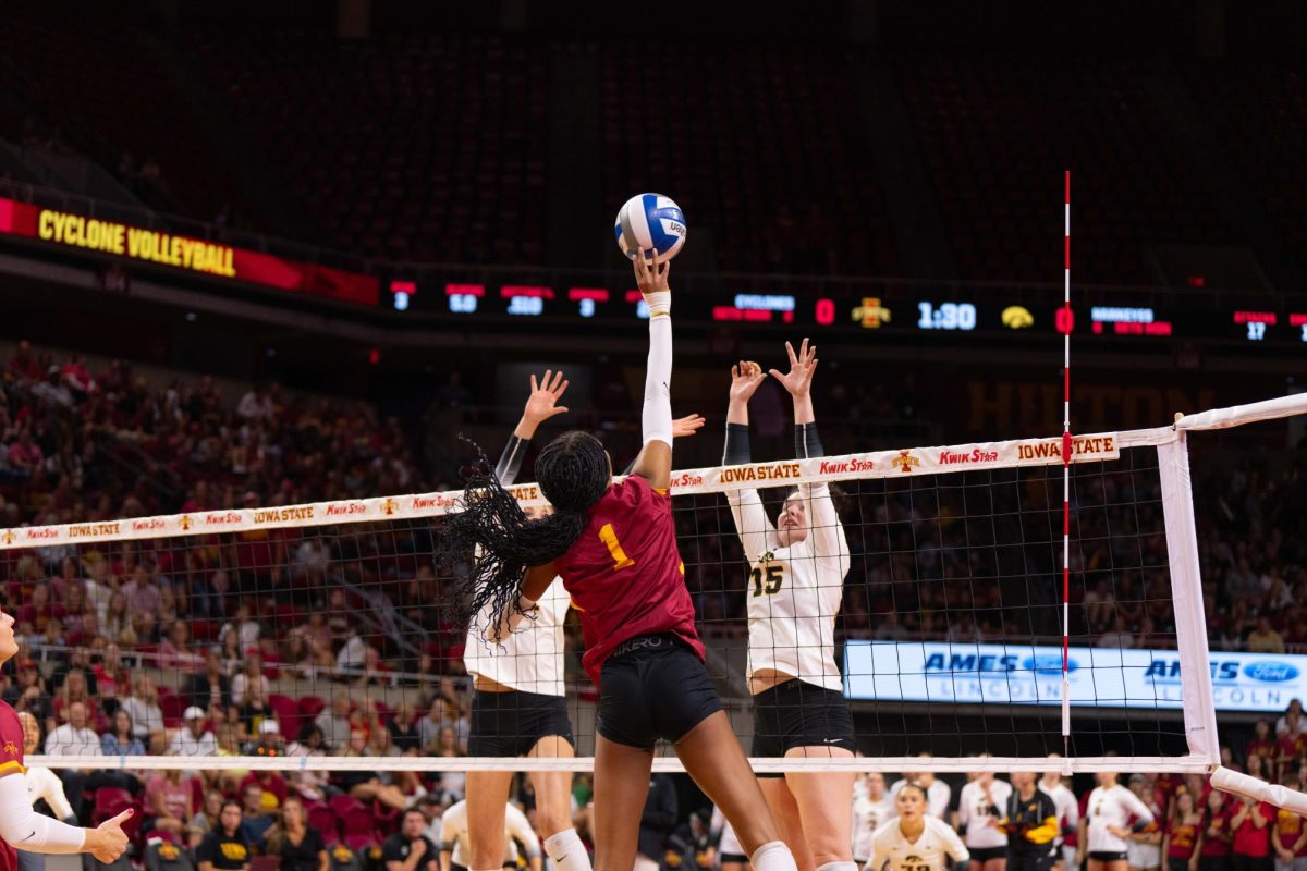 Pam McCune spikes the ball during the Iowa Corn Cy-Hawk series volleyball meet against the University of Iowa, Hilton Coliseum, Sept. 11, 2024.