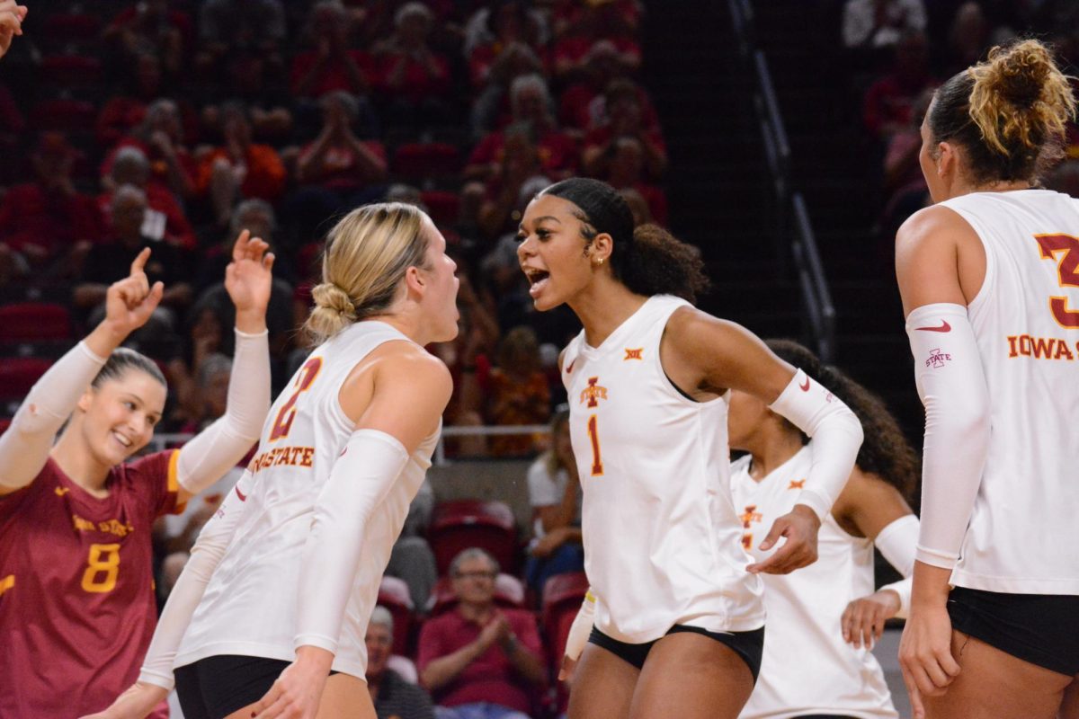 Morgan Brandt (2) and Pam McCune (1) celebrate scoring, Hilton Coliseum, Ames, Iowa, Sept. 28, 2024.