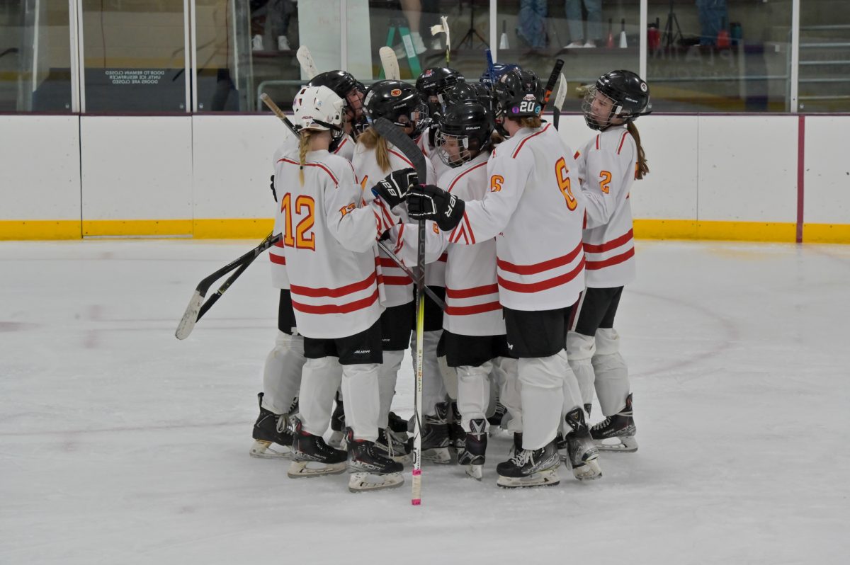 Iowa State women's hockey club celebrates their first win of the season vs university of Iowa at ISU Ice Arena, Sept. 27, 2024.