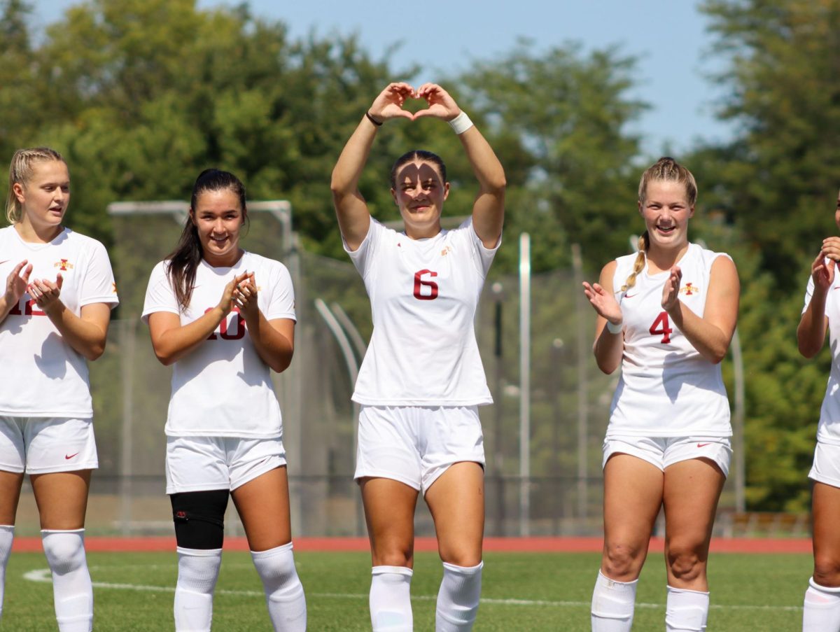 Chloe Broughton (6) makes a heart out of her hands during the Iowa State starting line up announcement at the Iowa State vs. University of Iowa soccer match on Sep. 15, 2024 at the Cyclones Sports Complex.  