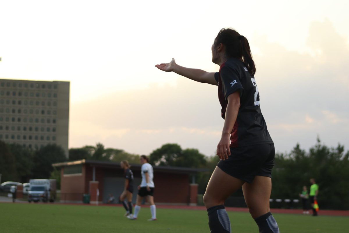 Seulgi Lee (27) throws her hand up in protest against the referee not calling a foul at the Iowa State vs. University of Central Florida match, Cyclone Sports Complex, Sep. 19, 2024.